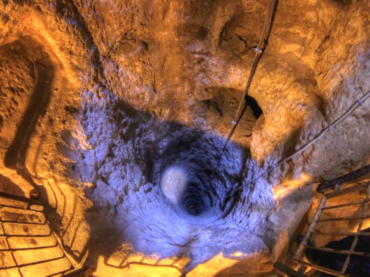 Narrow stairway cut into the rock descending toward the lower levels of Derinkuyu