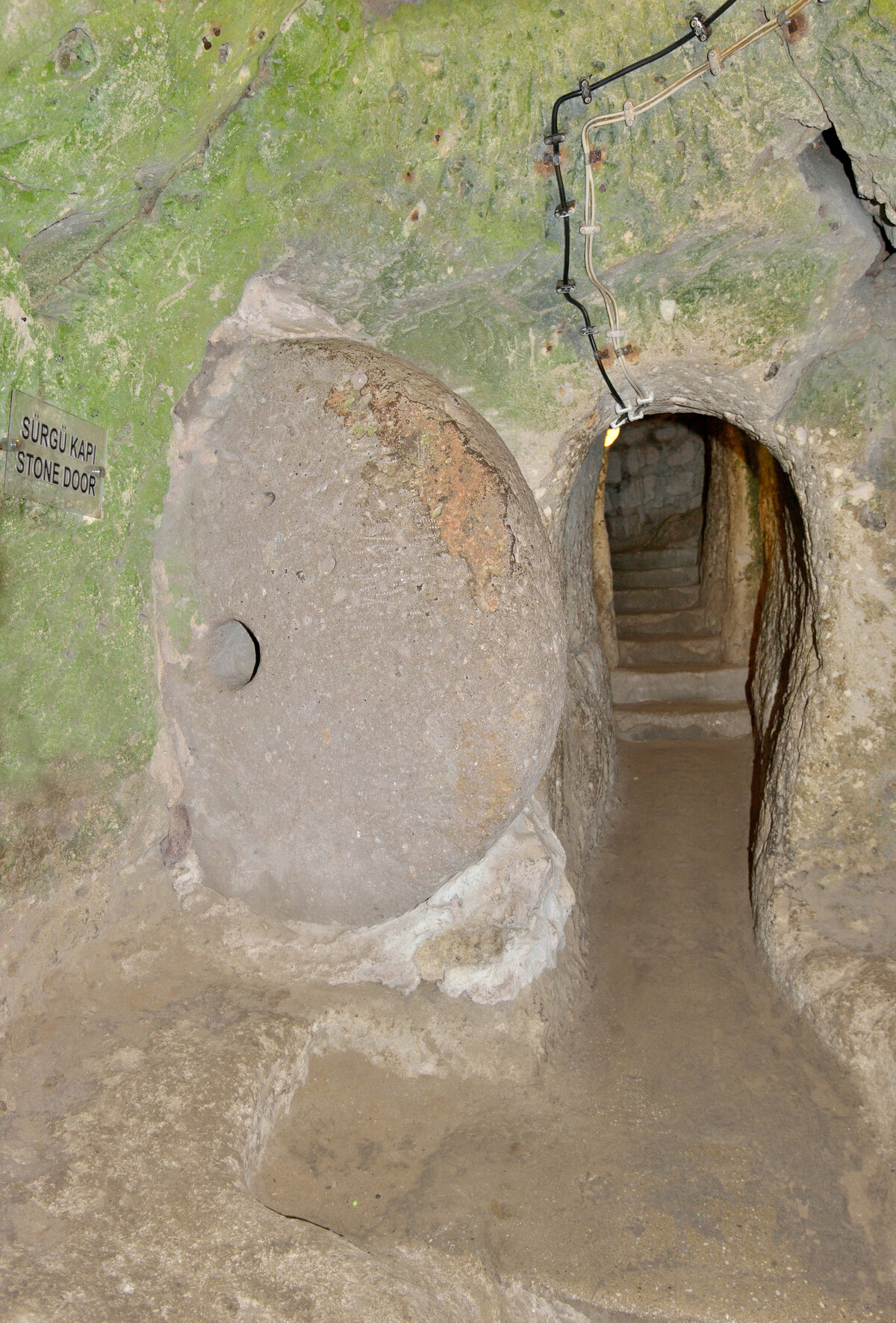 Large circular stone door used to close a Derinkuyu tunnel from the inside