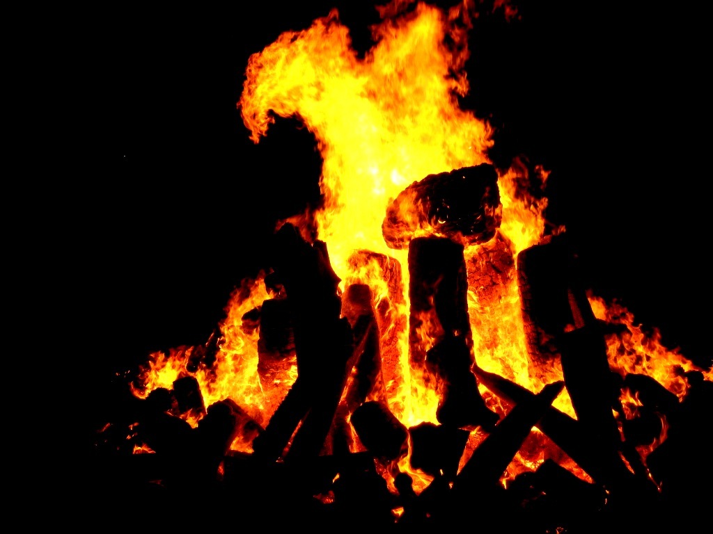 Campfire at night representing ancestral use of fire