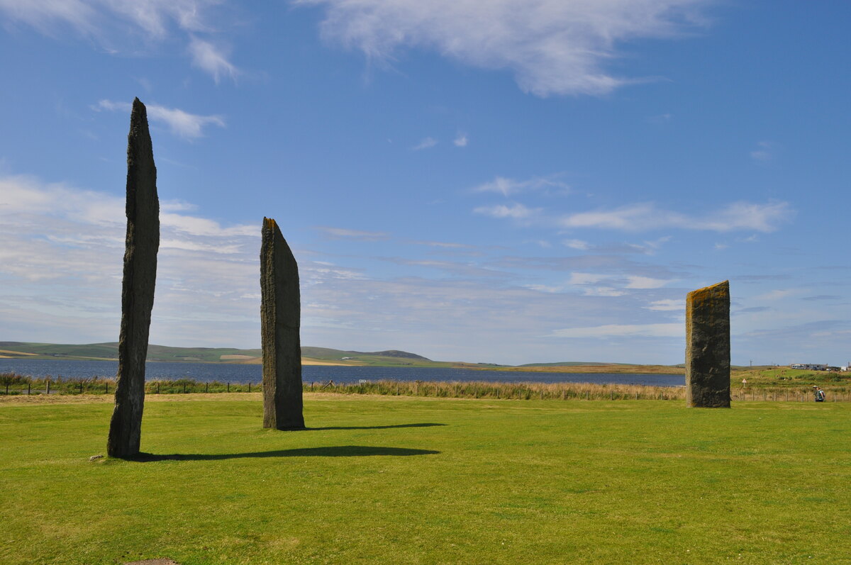 The tall standing stones of Stenness silhouetted against the Orkney sky