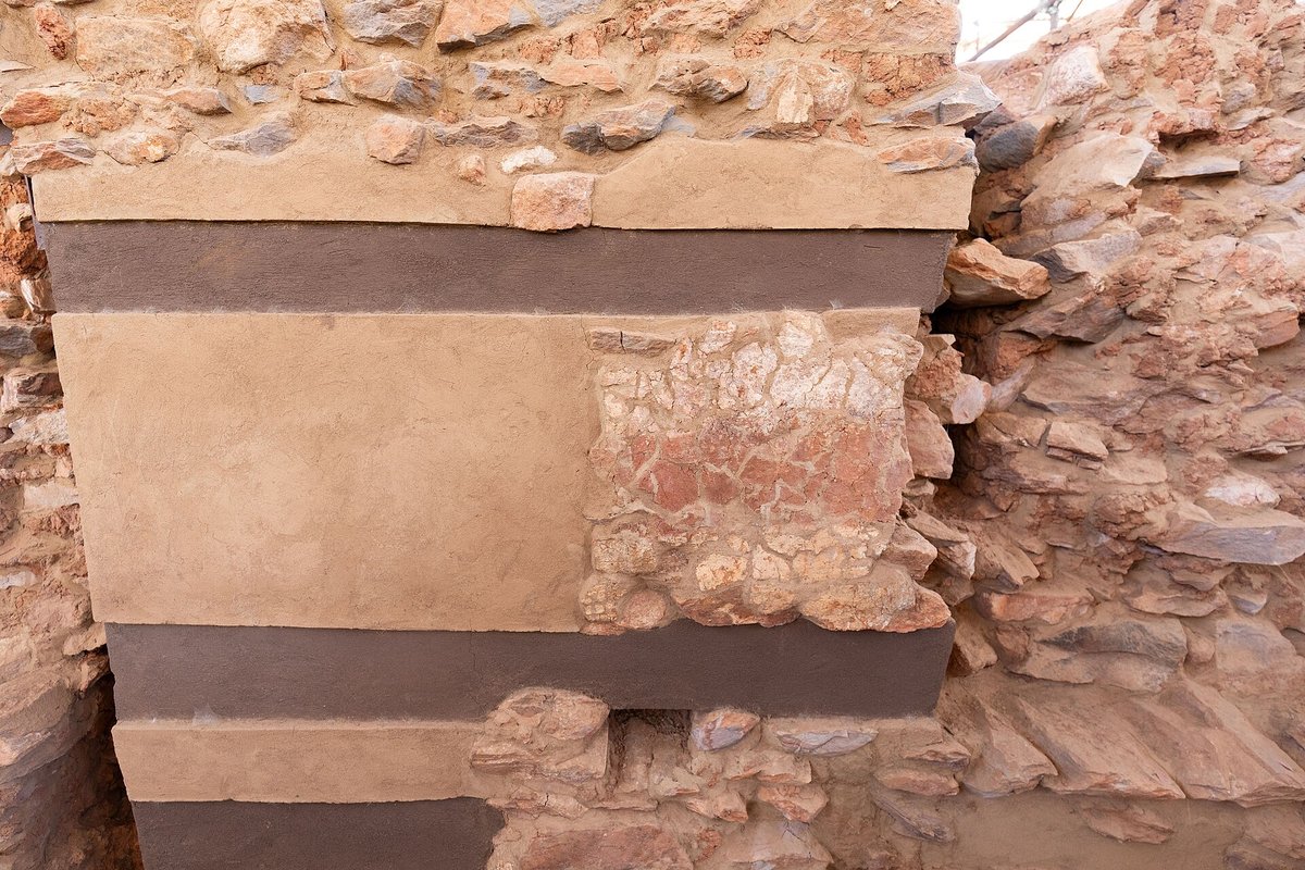 Section of wall of the Yeha palace showing alternating rubble masonry and smooth bands marking the positions of vanished beams