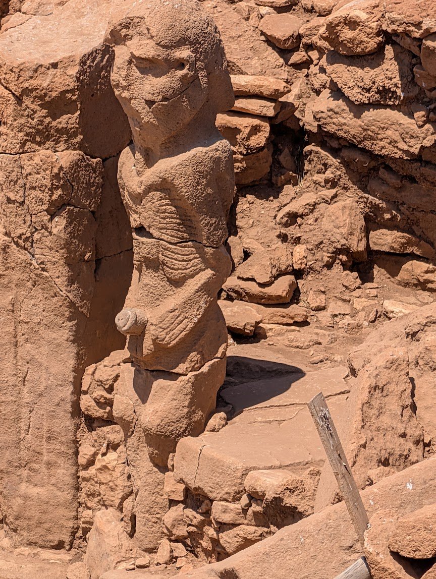 Stone statue of a seated man, uncovered in an excavation pit at Karahan Tepe