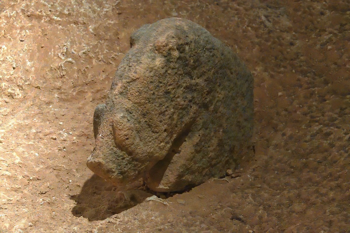 Limestone sculpture of a wild boar, seen in profile